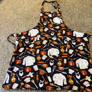 Like new chef apron by now designs. Adjustable around neck with ties at waist